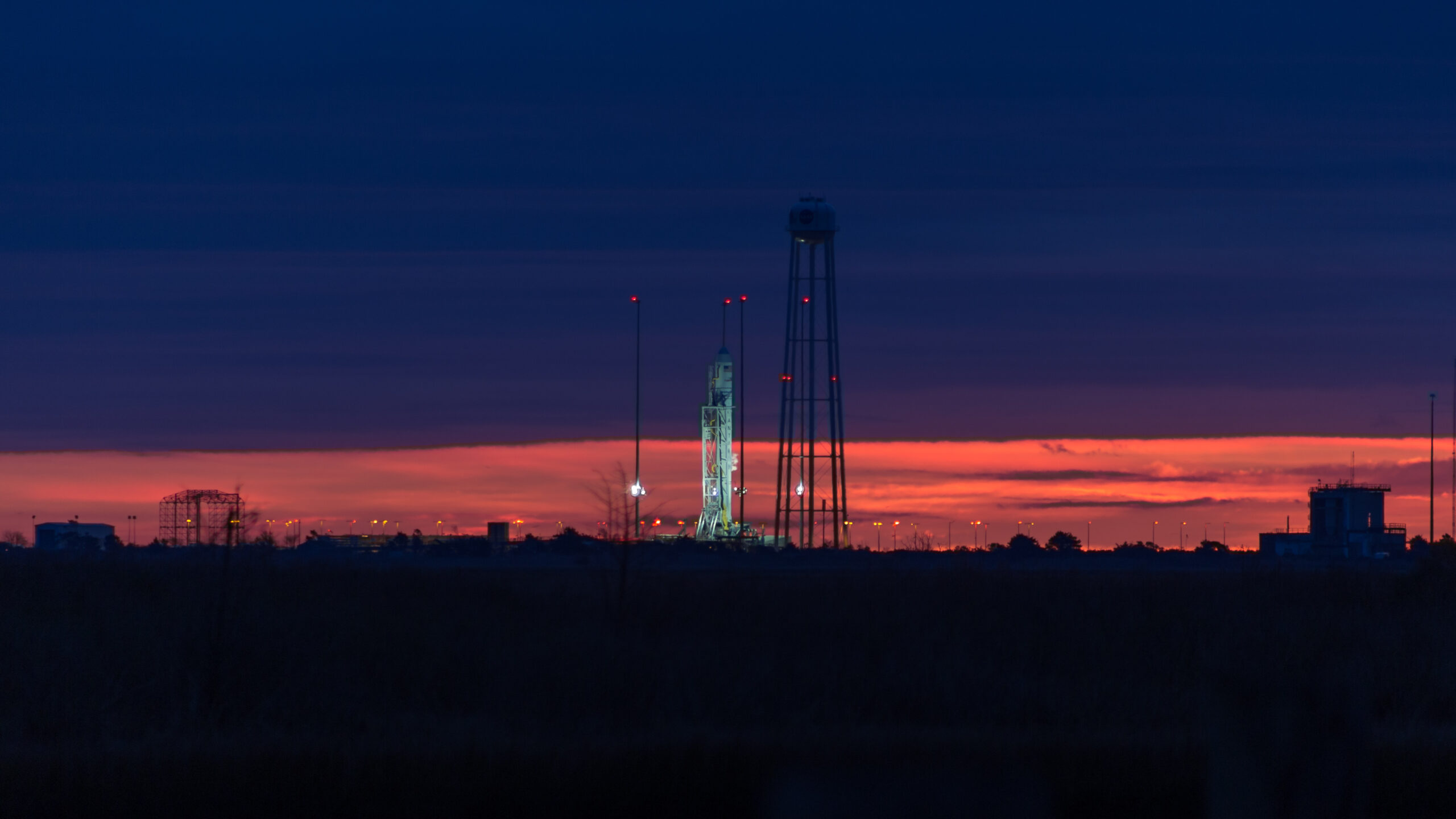 Sunrise over the Orbital ATK Antares rocket at NASA's Wallops Flight Facility